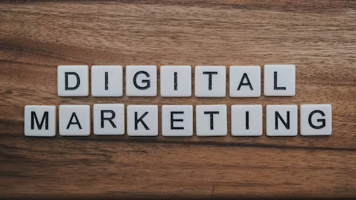 Small business digital marketing concept spelled out on wooden table.