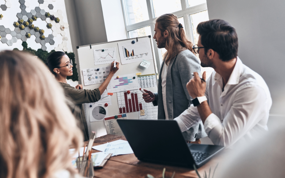 An Outsourced CMO presenting a marketing strategy to her team